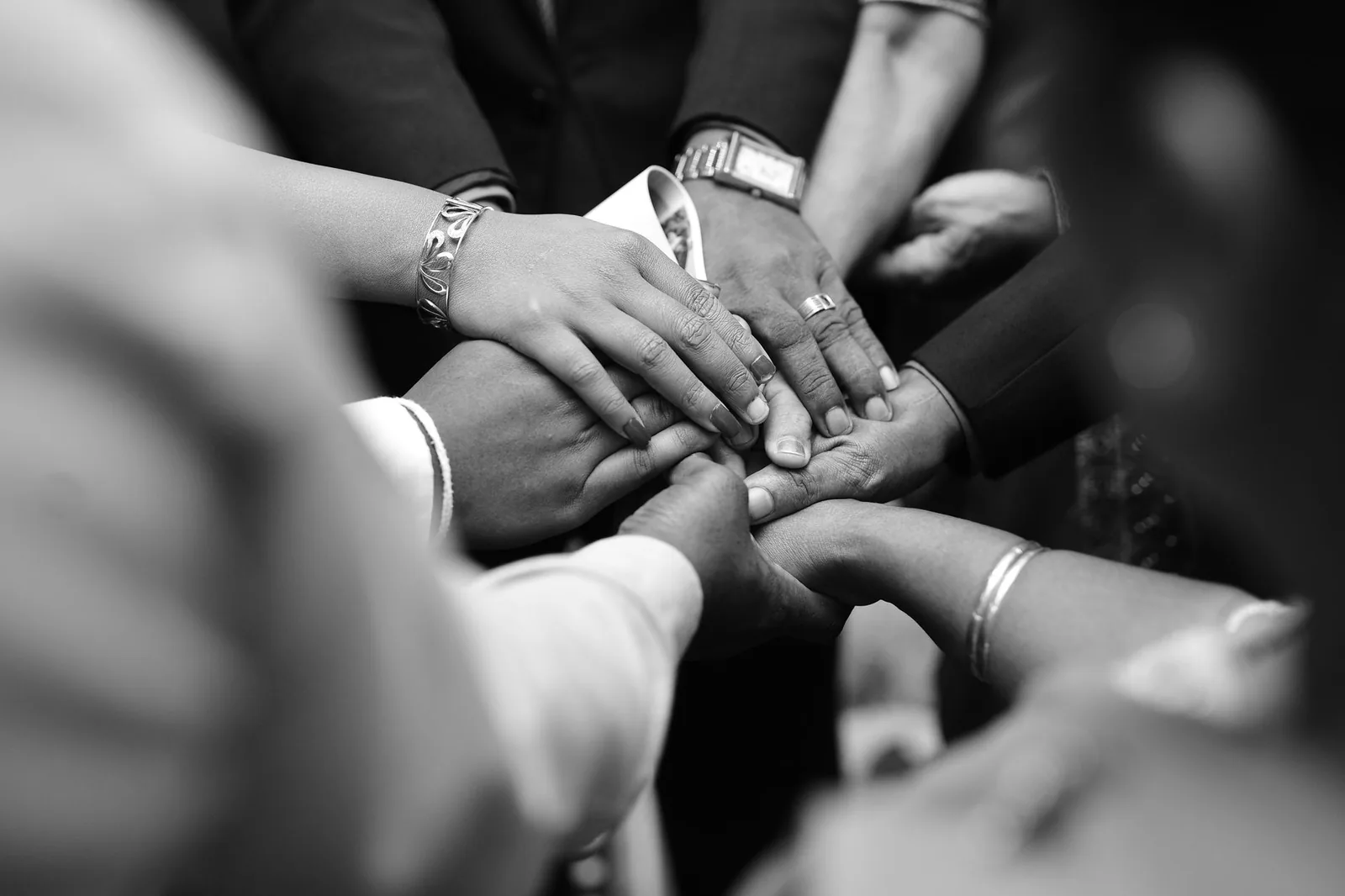 Hands joined together in belonging, symbol of joining the AGAMI community